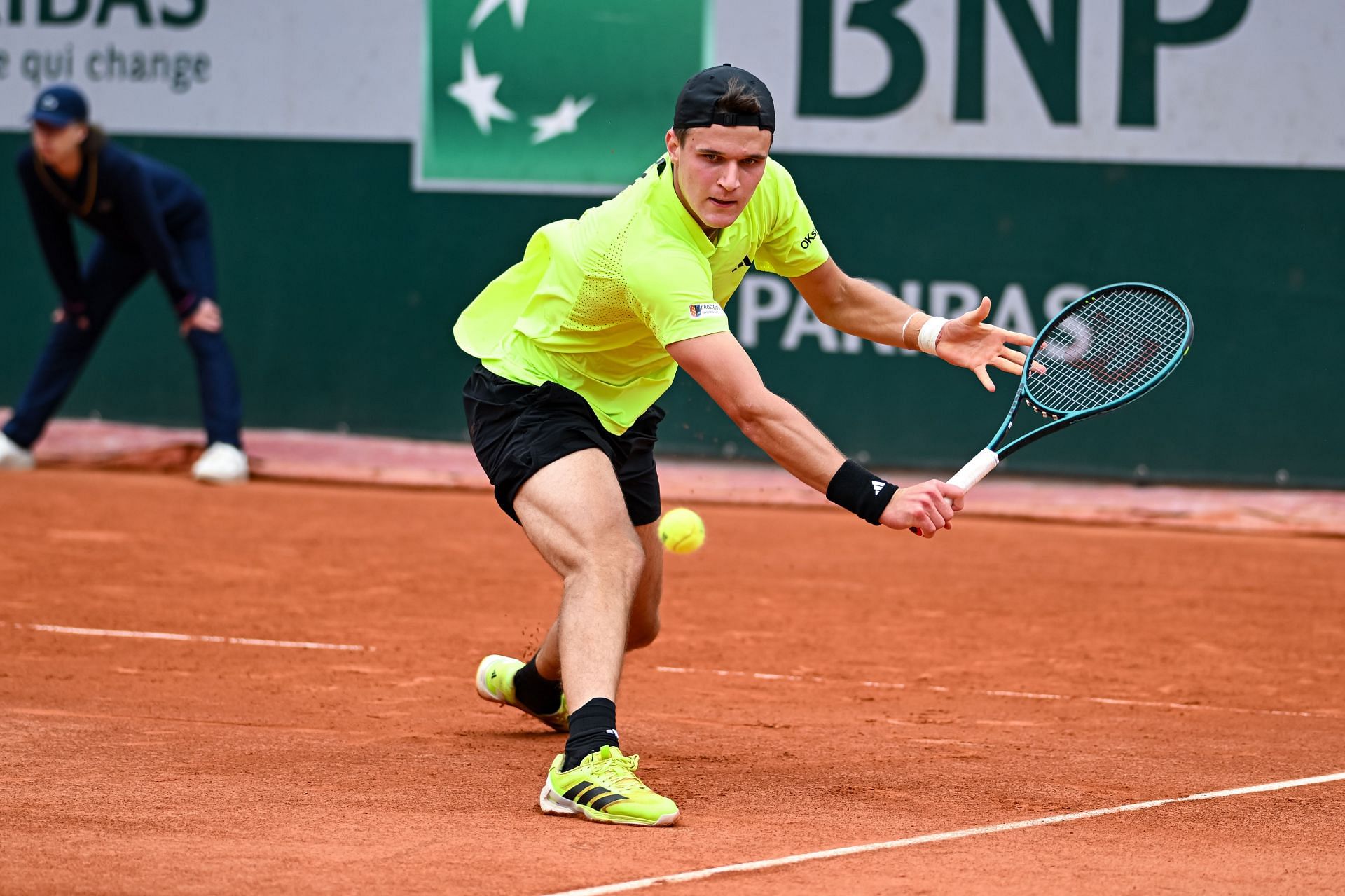 Jakub Mensik retrieves a ball during his French Open 1R win | Image Source: Getty